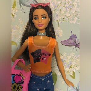 Barbie Doll with Orange Top and Pink Bag